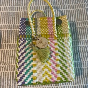 Multi colored Mandy’s handwoven handbags.  Super cute small tote.